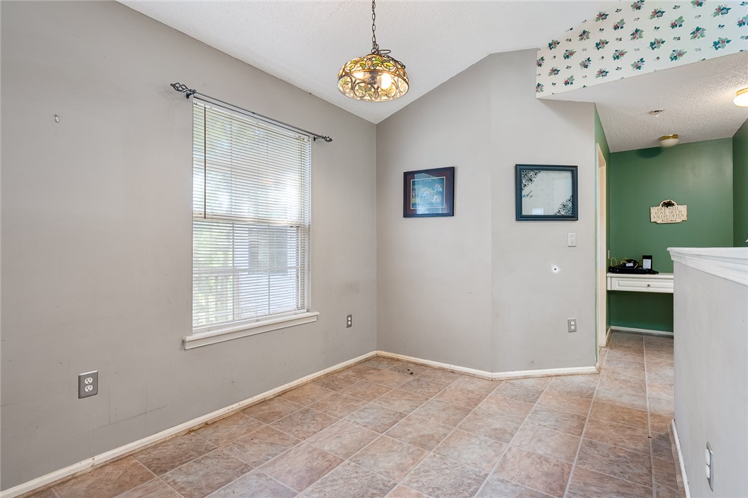 306 Lakewood Drive Anderson, SC 29621 - Photo 9 of 17 This bright space features a unique ceiling detail and resilient tile flooring.