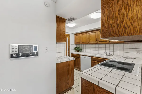 a kitchen that has a sink and a stove