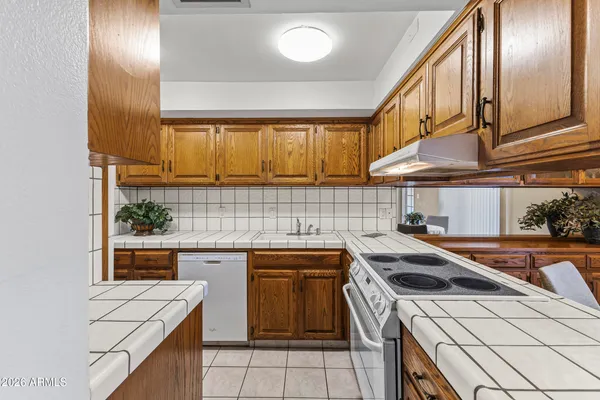 a kitchen with a sink and large window