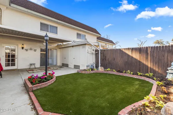 a view of a backyard with a patio