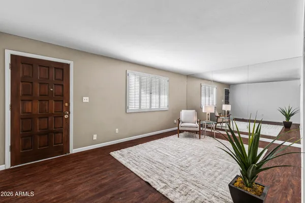 a living room with furniture and a potted plant