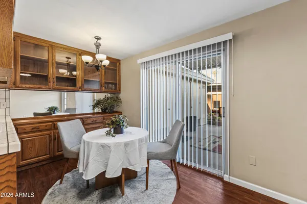 a dining room with furniture and window