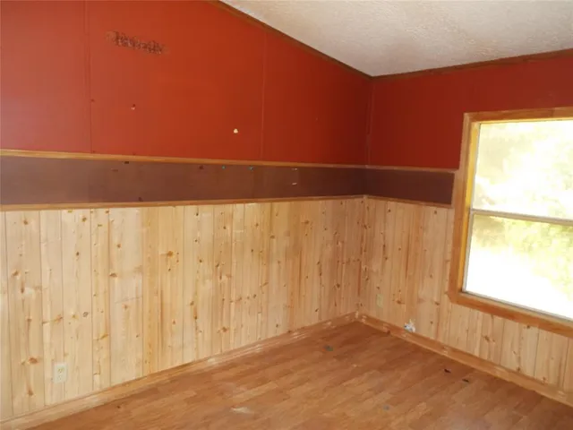 a view of an empty room and a window