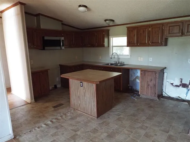 a kitchen with a cabinets and a sink