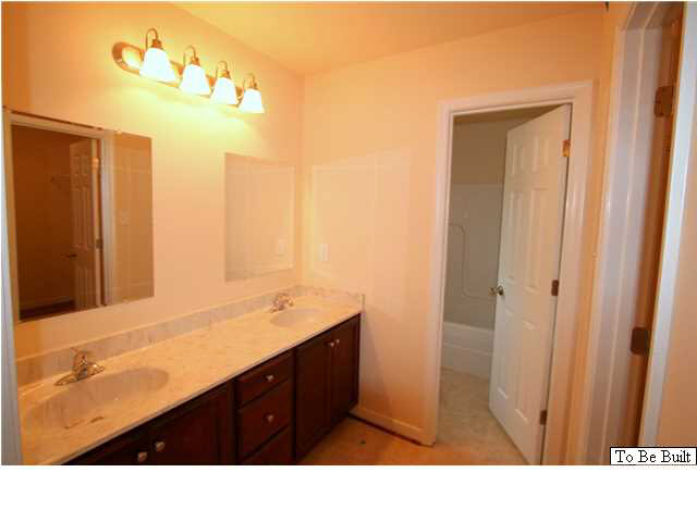 10 Winding Ridge Way Bumpass, VA 23024 - Photo 12 of 16 a bathroom with a sink double vanity and a mirror