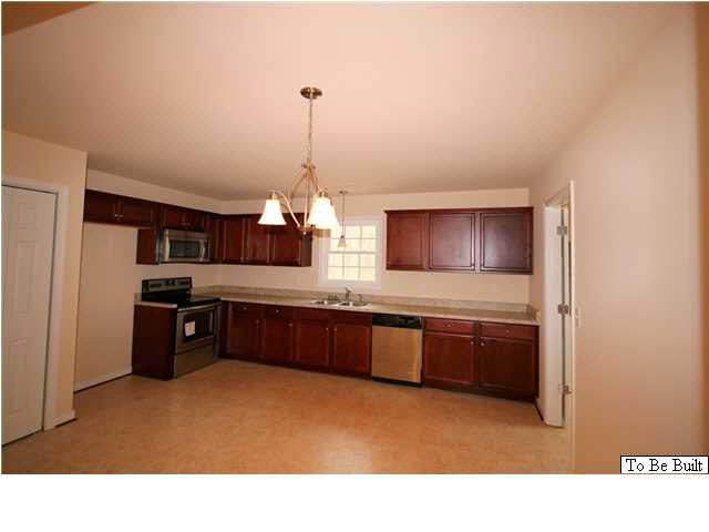 10 Winding Ridge Way Bumpass, VA 23024 - Photo 4 of 16 a kitchen with stainless steel appliances granite countertop a sink a stove and a refrigerator