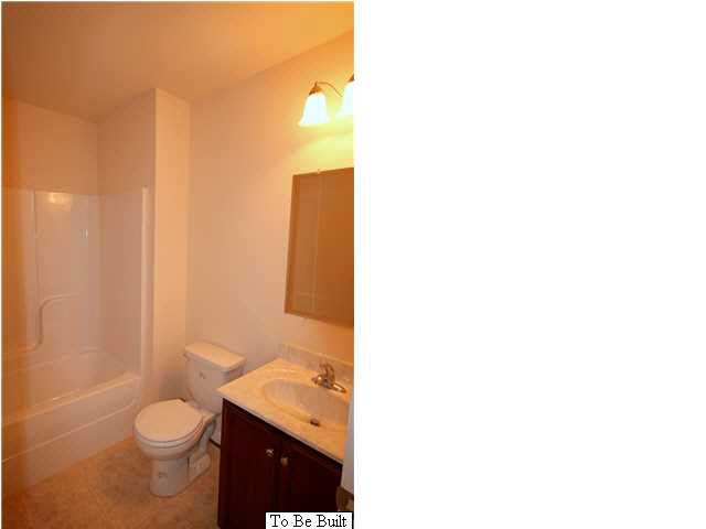 10 Winding Ridge Way Bumpass, VA 23024 - Photo 10 of 16 a bathroom with a granite countertop toilet a sink and a mirror