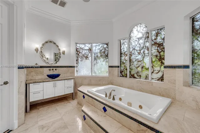 a view of a house with swimming pool and sitting area