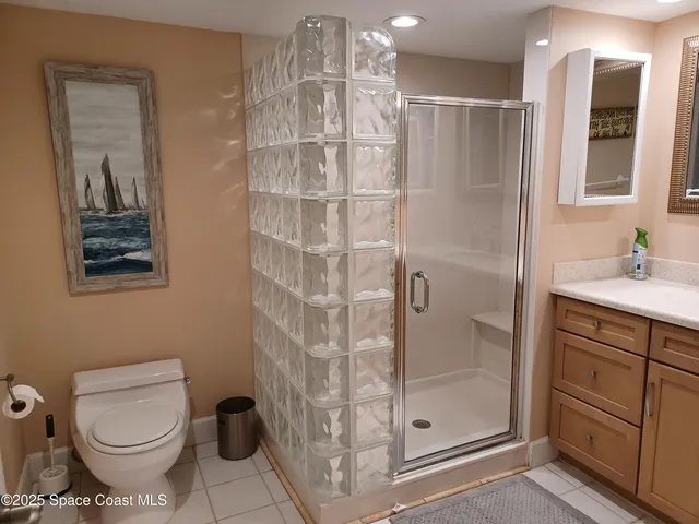 a bedroom with bed and a night stand