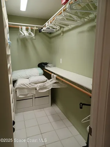 a view of a patio with couple of chairs and a fountain