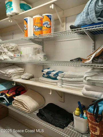 a view of a balcony with chairs
