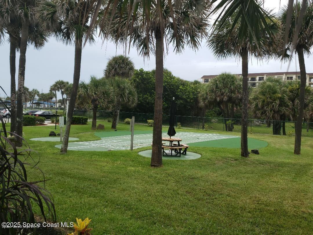 2100 North Atlantic Avenue, Unit 901 Cocoa Beach, FL 32931 - Photo 34 of 54 a view of a park with palm trees