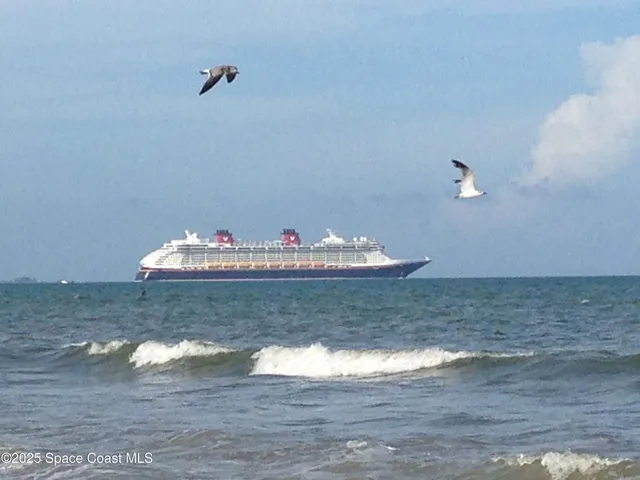 a group of people sitting in front of retail shop
