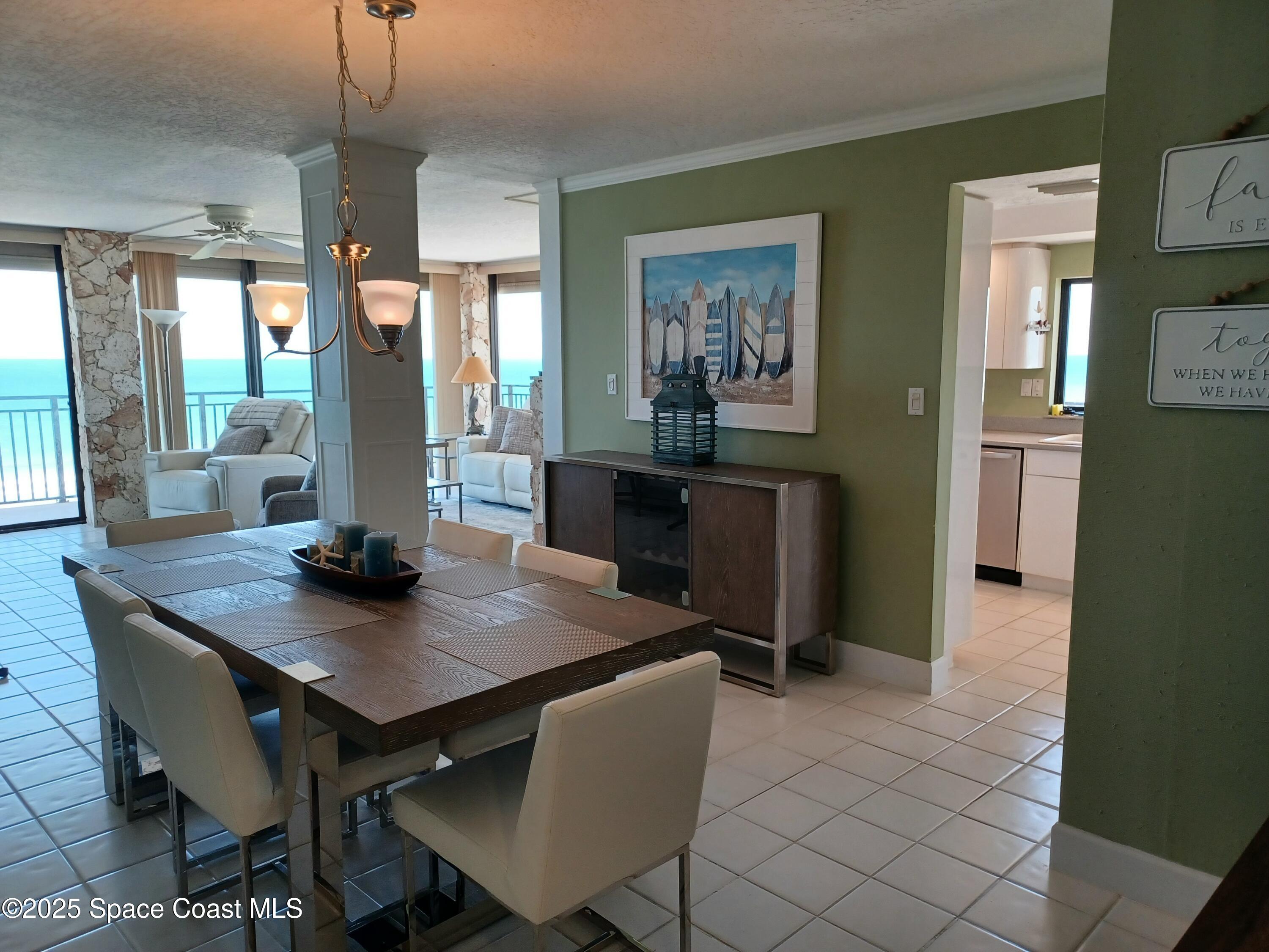 2100 North Atlantic Avenue, Unit 901 Cocoa Beach, FL 32931 - Photo 10 of 54 a view of a dining room with furniture