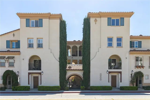 a view of building with car parked