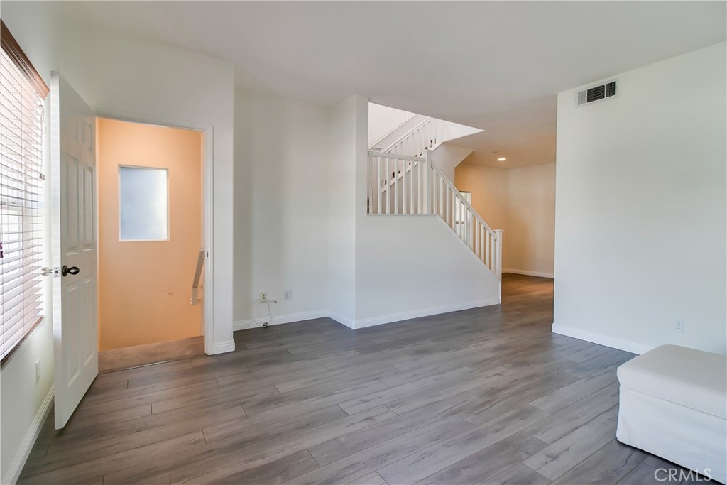 620 East Walnut Street Pasadena, CA 91101 - Photo 4 of 15 a view of an empty room with wooden floor and a window