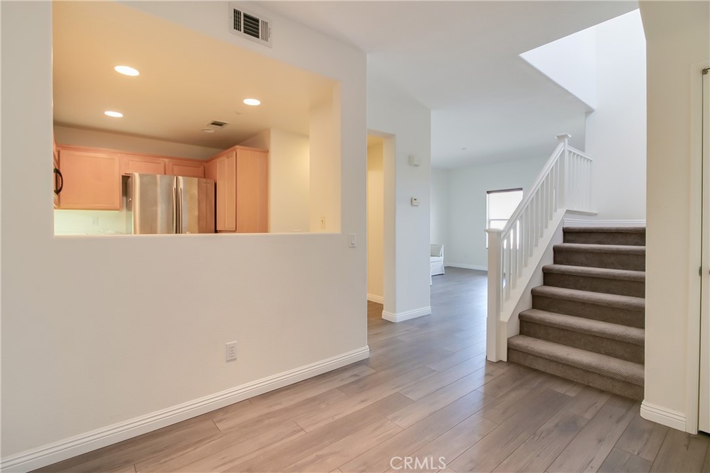 620 East Walnut Street Pasadena, CA 91101 - Photo 6 of 15 a view of a hallway with wooden floor and entryway