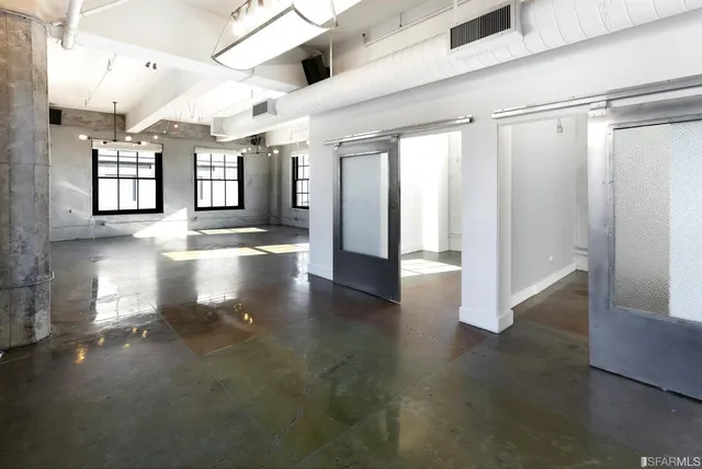 a kitchen with stainless steel appliances granite countertop a stove and a sink