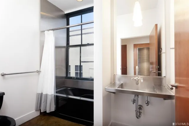 a roof deck with a table and chairs