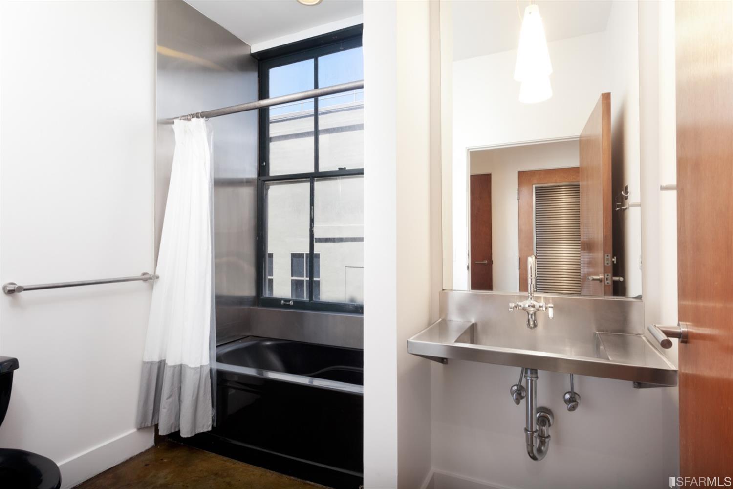 2 Mint Plaza, Unit 801 San Francisco, CA 94103 - Photo 15 of 28 a bathroom with a sink and a mirror