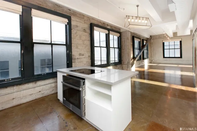 a kitchen with a stove and a refrigerator