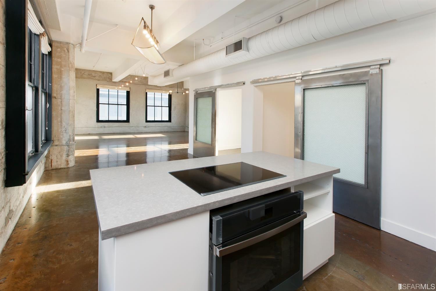 2 Mint Plaza, Unit 801 San Francisco, CA 94103 - Photo 3 of 28 a kitchen with a stove and a refrigerator