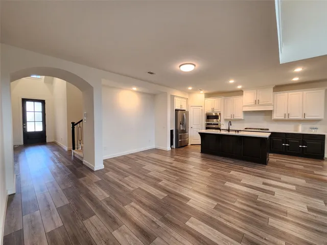 a view of kitchen and kitchen with wooden floor