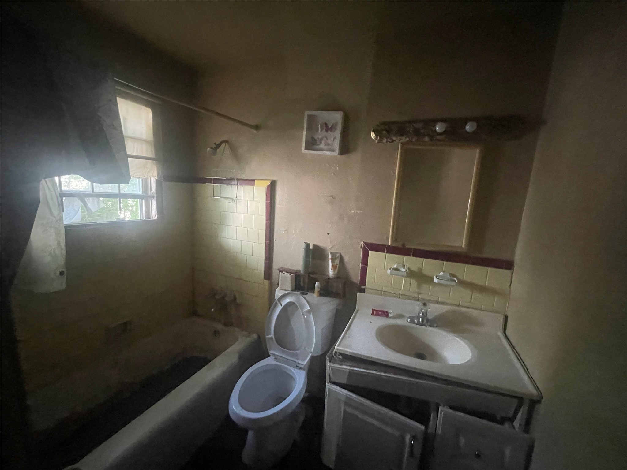 4854 Clover Street Houston, TX 77033 - Photo 6 of 8 a bathroom with a sink toilet and shower