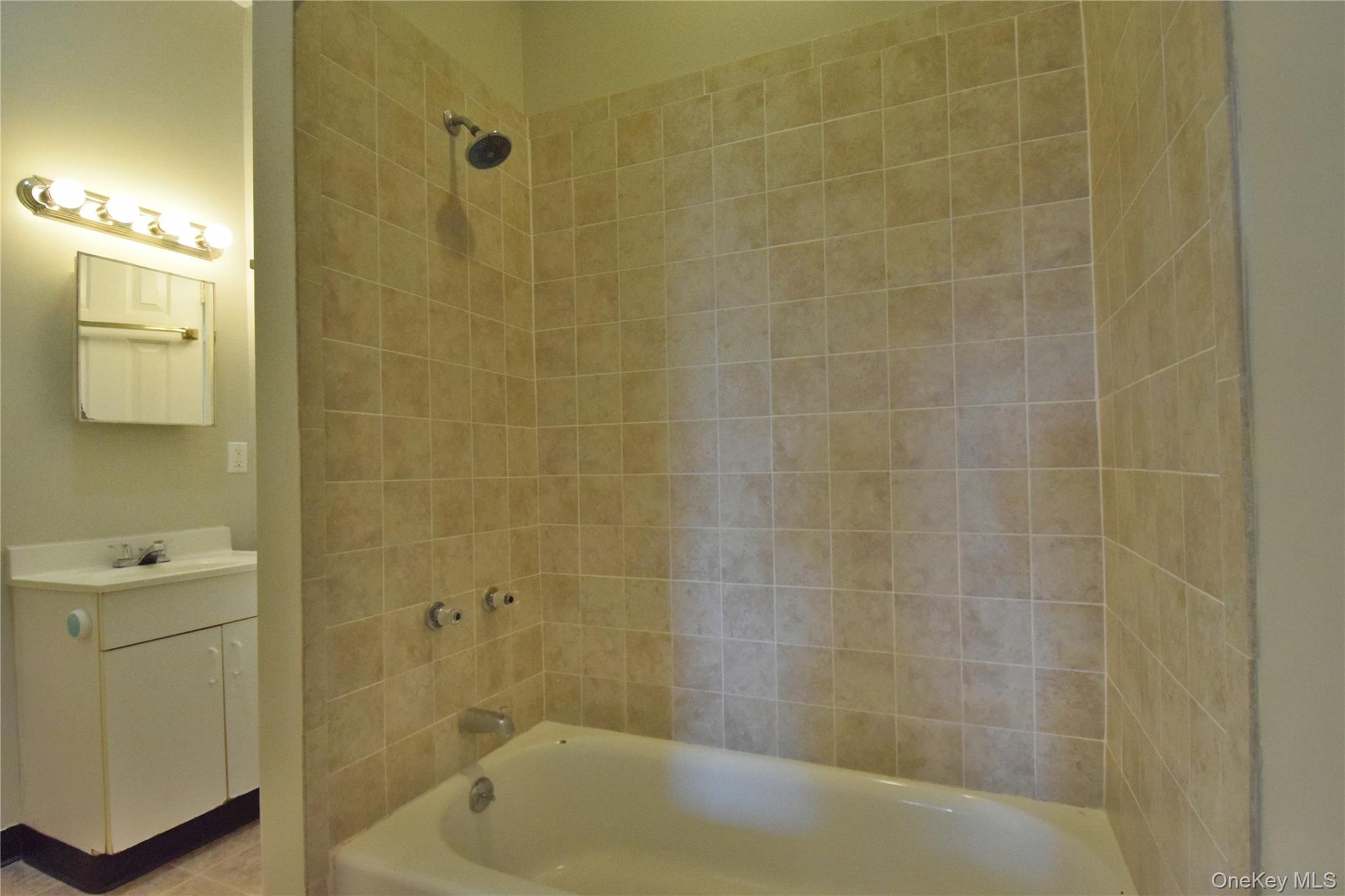 12 Railroad Avenue, Unit 2 Chester, NY 10918 - Photo 7 of 12 a bathroom with a shower and a bathtub