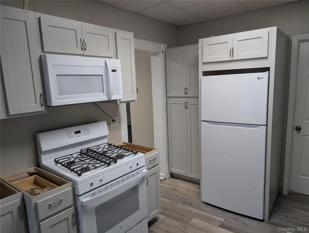 a kitchen with a stove and a refrigerator