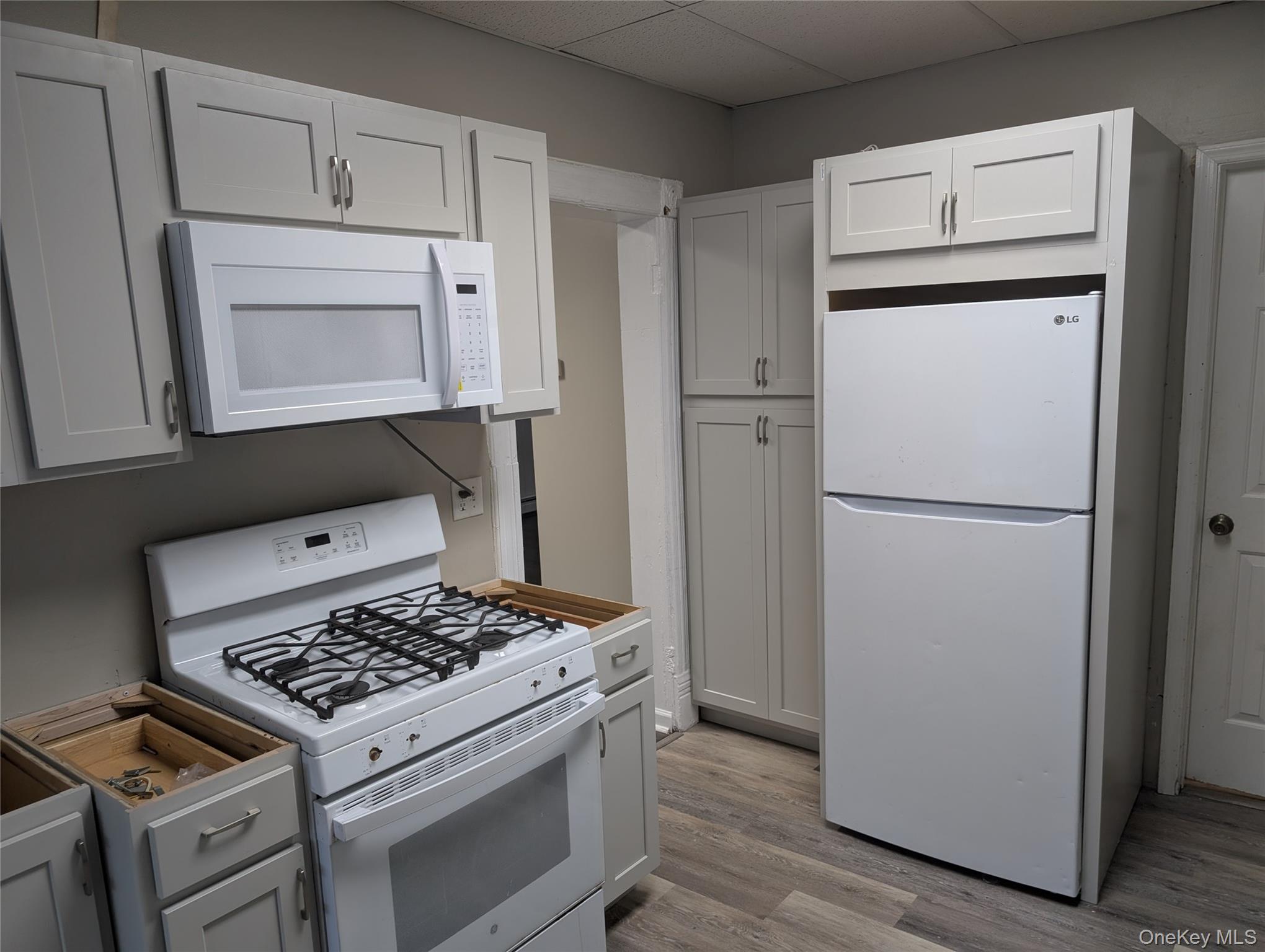 12 Railroad Avenue, Unit 2 Chester, NY 10918 - Photo 8 of 12 a kitchen with a stove and a refrigerator