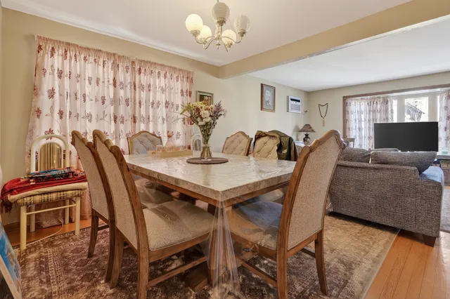a view of a dining room with furniture and window
