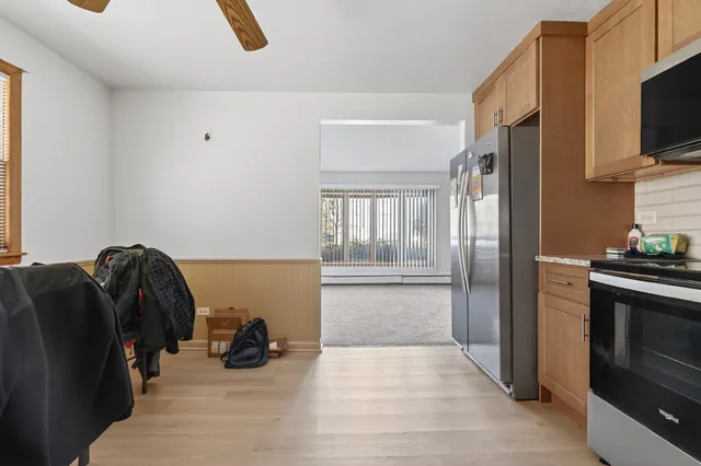 a view of a livingroom with furniture and a flat screen tv