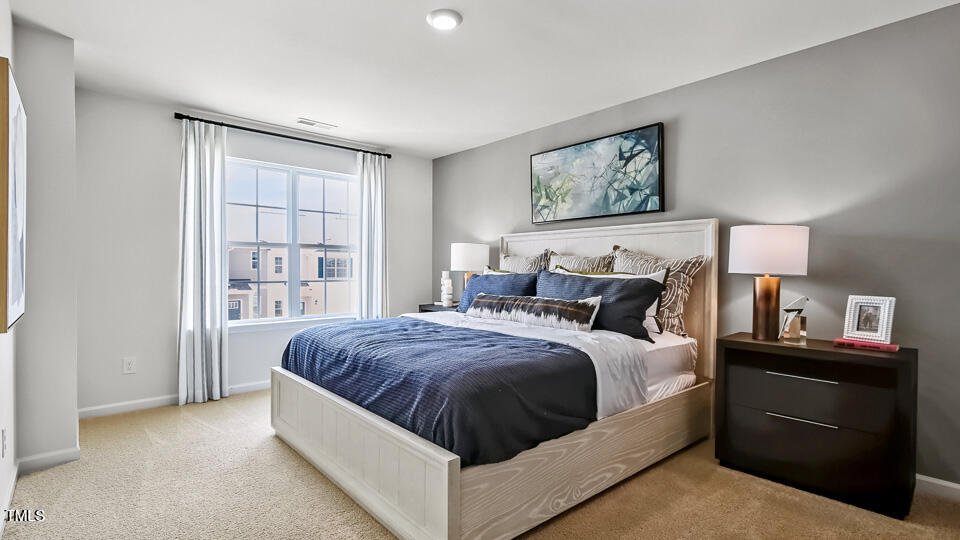 5203 Red Crimson Drive Willow Spring, NC 27592 - Photo 15 of 29 a bed room with a bed and a night stand