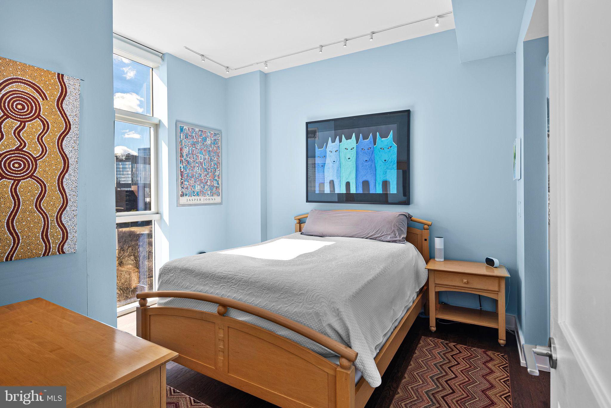 210 South 25th Street, Unit 905 Philadelphia, PA 19103 - Photo 12 of 28 a bedroom with a bed and a window