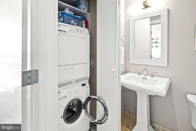 a bathroom with a sink a mirror and shower