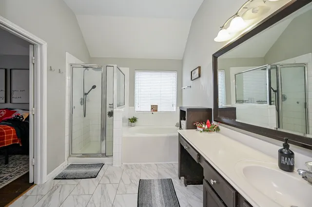 a bathroom with a sink double vanity and a mirror