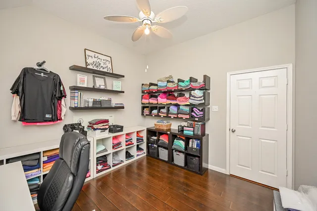 a view of a workspace with furniture and toys