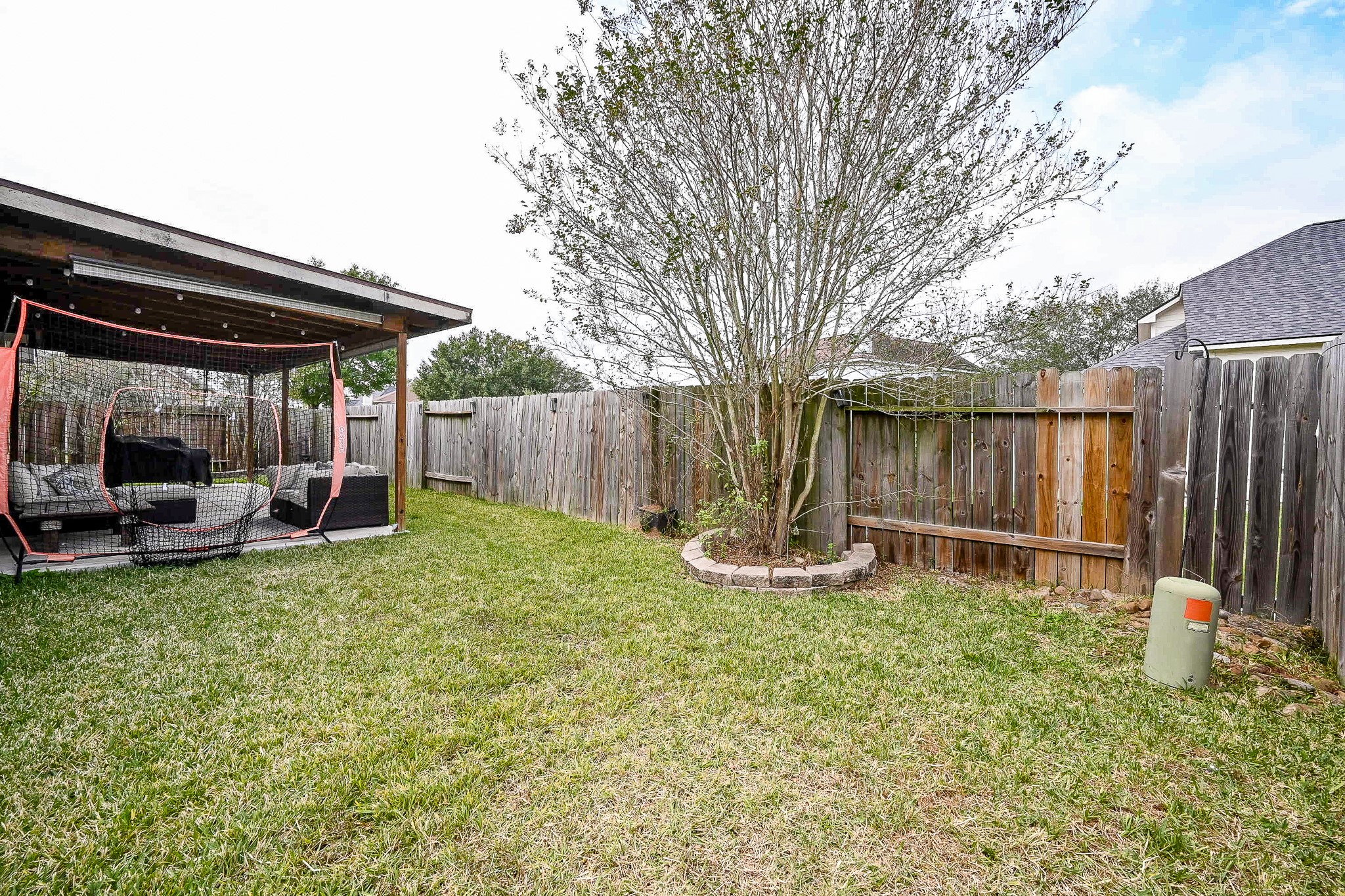 3907 Tigris Ridge Drive Katy, TX 77449 - Photo 20 of 20 a backyard of a house with garden and outdoor seating