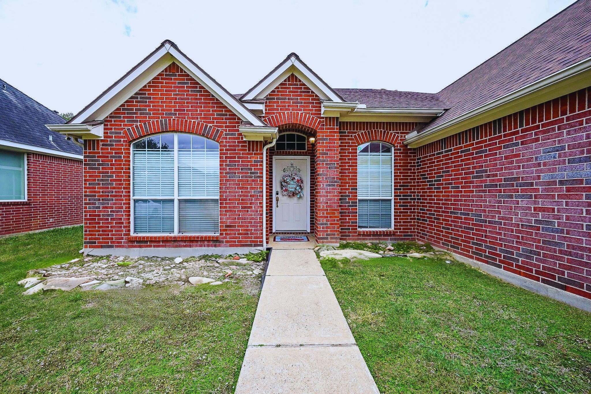 3907 Tigris Ridge Drive Katy, TX 77449 - Photo 2 of 20 a front view of a house with garden