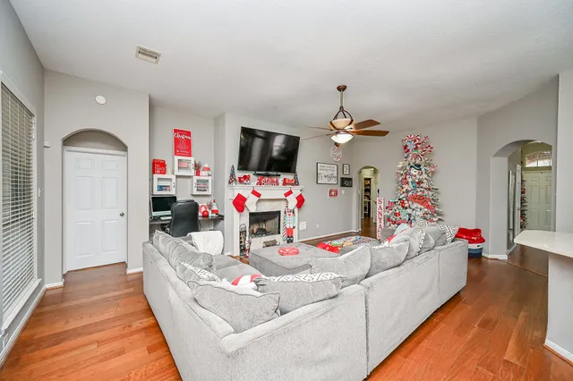 a living room with furniture and a flat screen tv