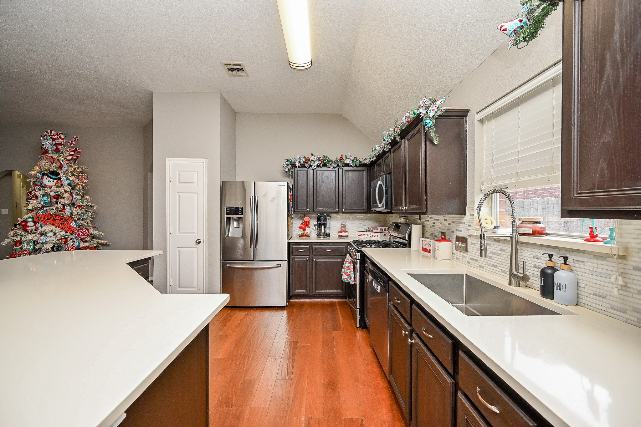 3907 Tigris Ridge Drive Katy, TX 77449 - Photo 9 of 20 a kitchen with a sink and refrigerator