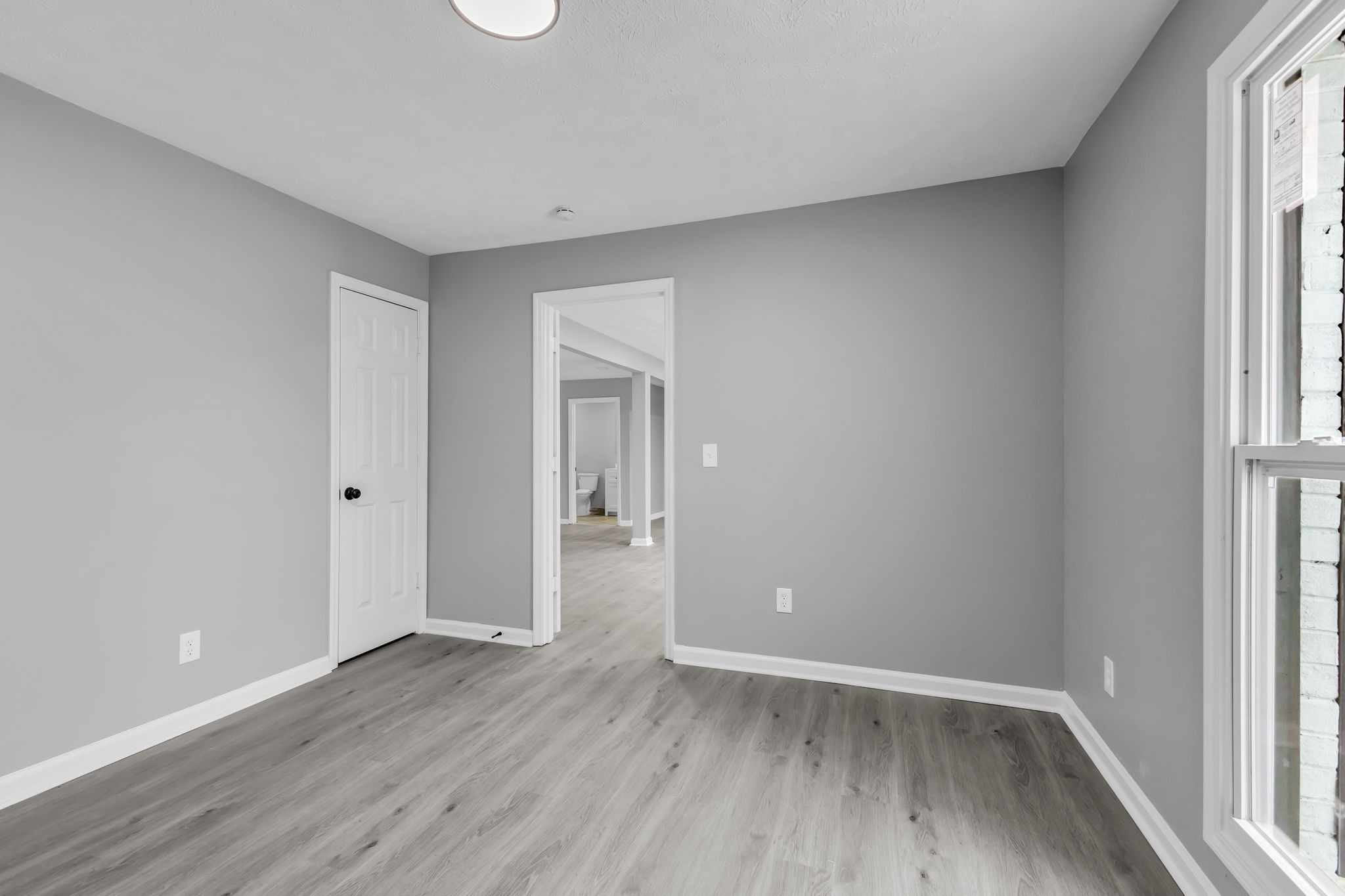 200 Upwind Court Nashville, TN 37217 - Photo 24 of 49 a view of an empty room with wooden floor and a window