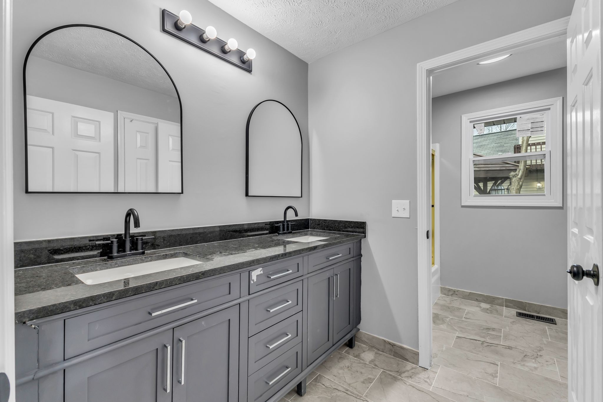 200 Upwind Court Nashville, TN 37217 - Photo 32 of 49 a bathroom with a granite countertop sink a mirror and cabinets