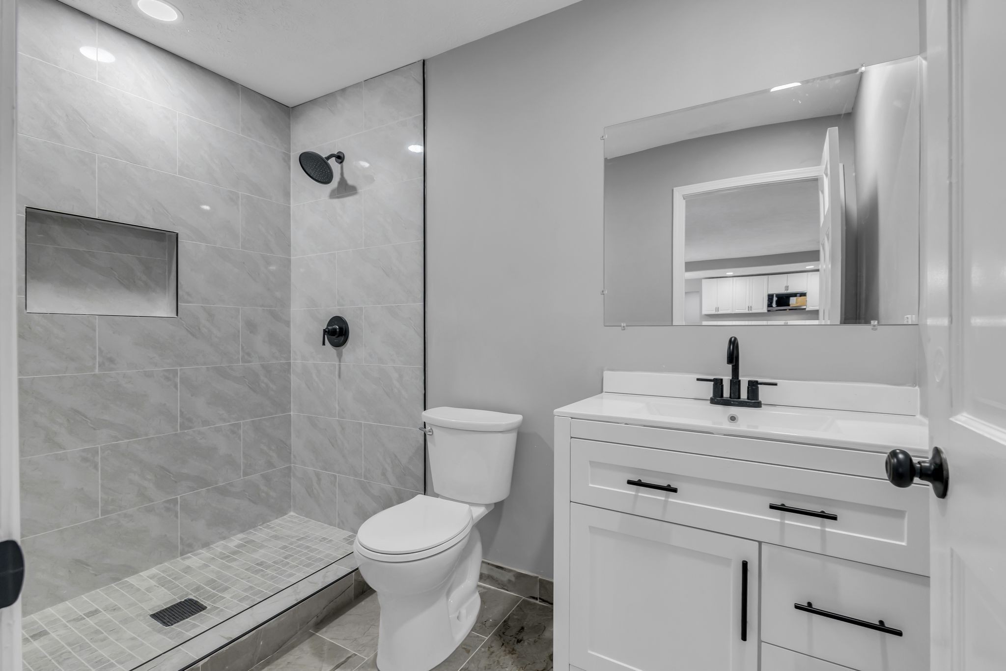 200 Upwind Court Nashville, TN 37217 - Photo 37 of 49 a bathroom with a sink toilet a mirror and shower