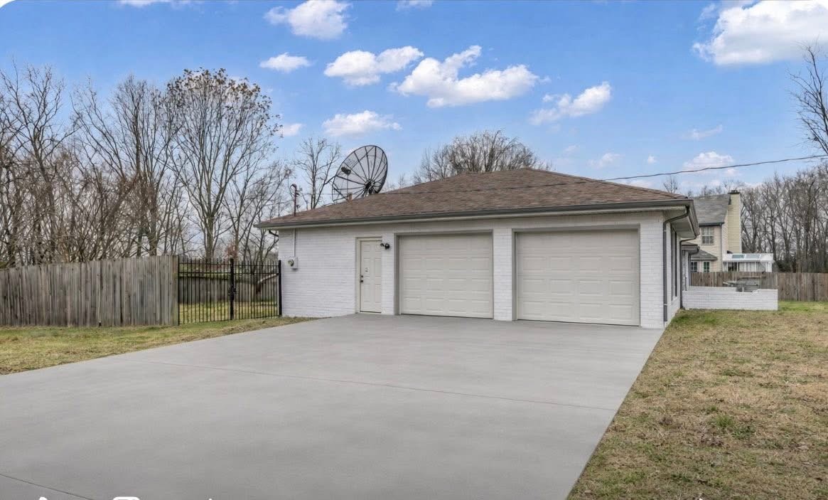 200 Upwind Court Nashville, TN 37217 - Photo 9 of 49 a view of a house with a garage and yard