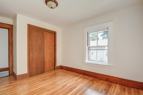 7 Martin Street Maynard, MA 01754 - Photo 15 of 28 an empty room with wooden floor and windows