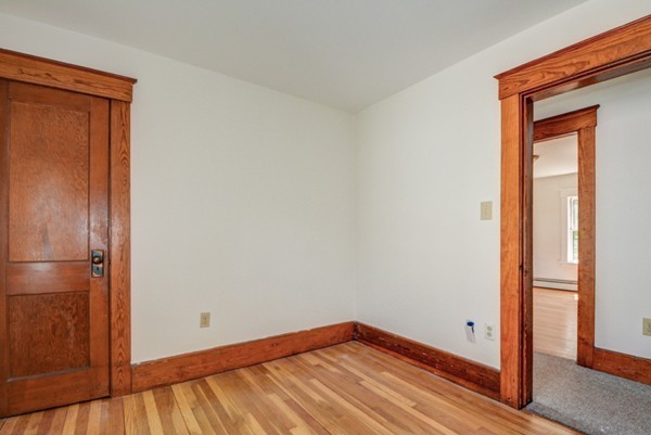 7 Martin Street Maynard, MA 01754 - Photo 17 of 28 a view of empty room with wooden floor and fan