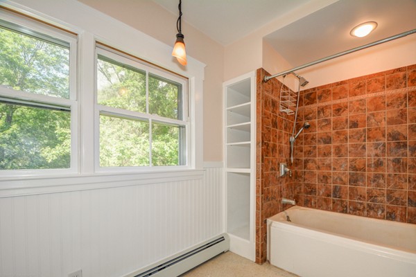 7 Martin Street Maynard, MA 01754 - Photo 20 of 28 a bathroom with a bathtub and a shower