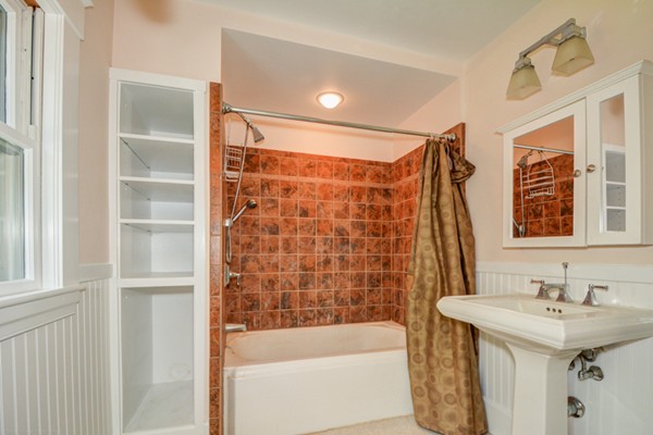7 Martin Street Maynard, MA 01754 - Photo 21 of 28 a bathroom with a sink and a bathtub